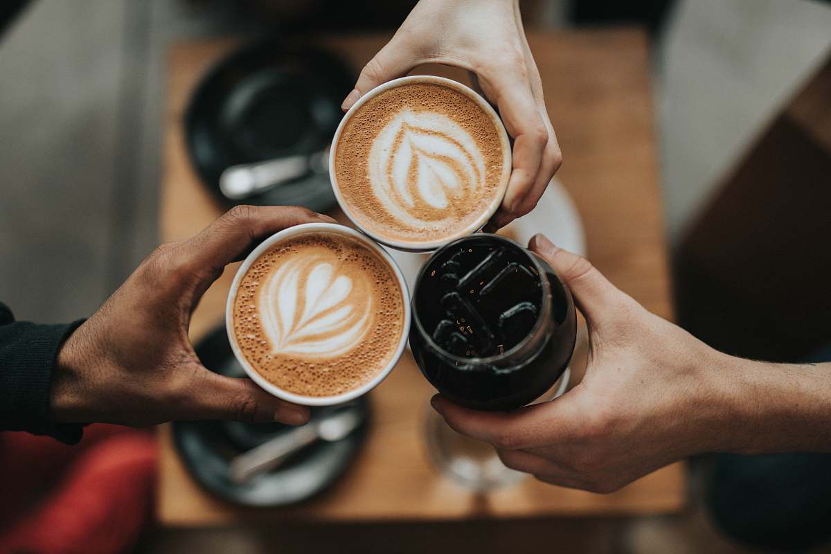 verve coffee three person holding beverage cups los angeles